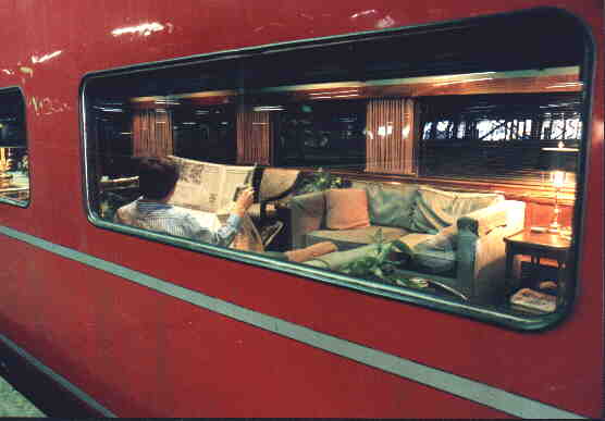 North Star guest enjoying the paper, parked in Philadelphia 30th Street Station 1991